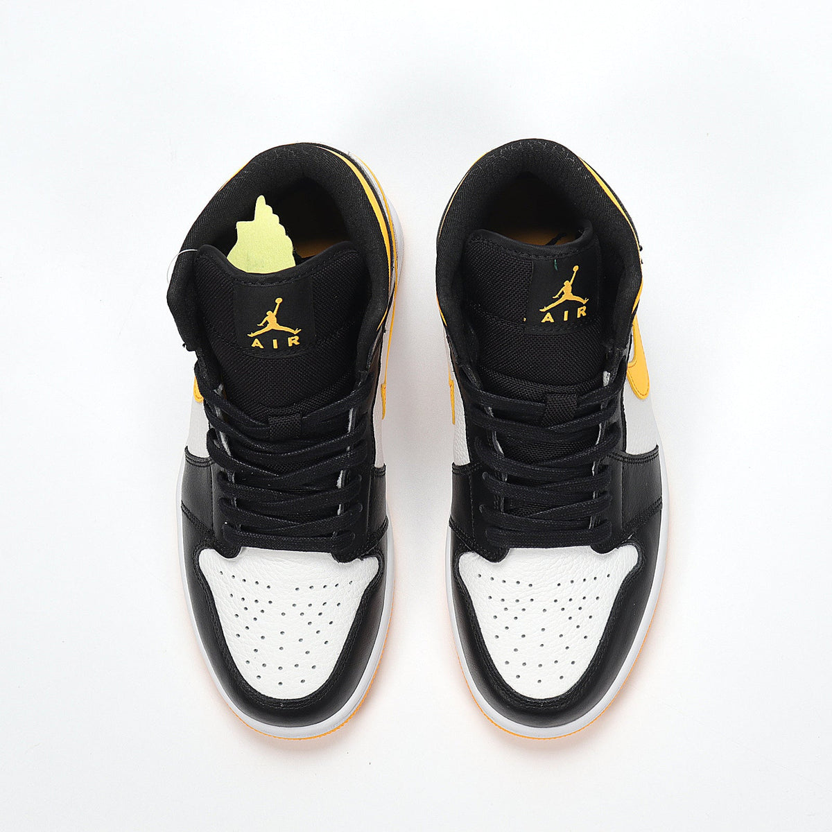 Jordan 1 High Sneakers in Black Yellow White CV5276-107 - product image from the listing.