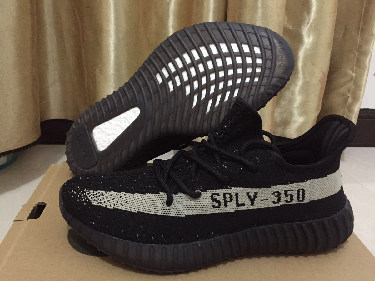 Adidas Yeezy Boost 350 V2 Sneakers in Black White - product image from the listing.