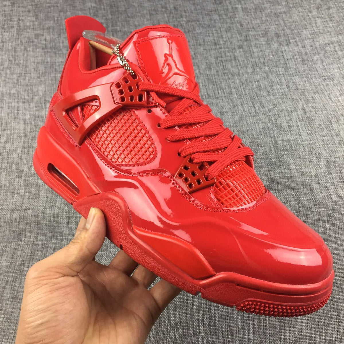 Air Jordan 4 Red Patent Leather Sneakers - product image from the listing.