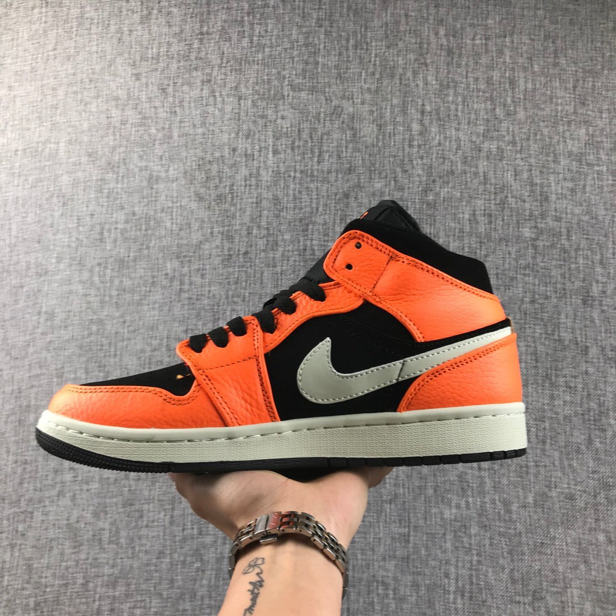Air Jordan 1 Mid Shattered Backboard Sneakers, in Black and Orange - product image from the listing.