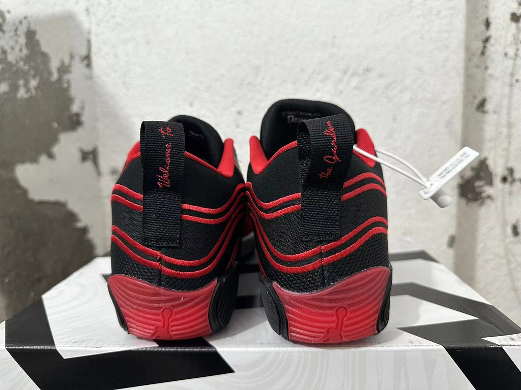 Jordan Tatum 1 Basketball Shoes in Black and Red - product image from the listing.