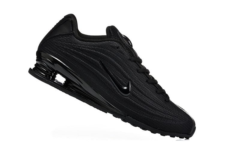 Nike Shox R4 Sneakers in Black - product image from the listing.
