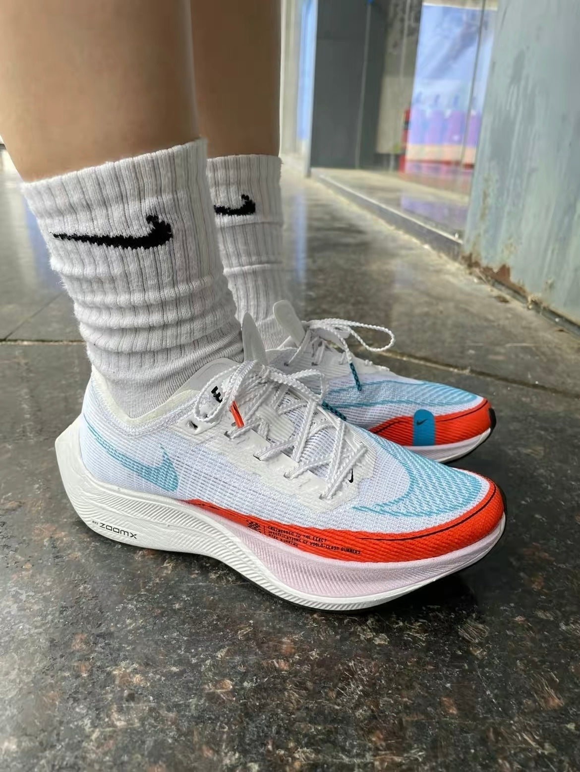 Nike ZoomX Vaporfly NEXT% 2 Running Shoes in White Blue Red CU4123-102 - product image from the listing.