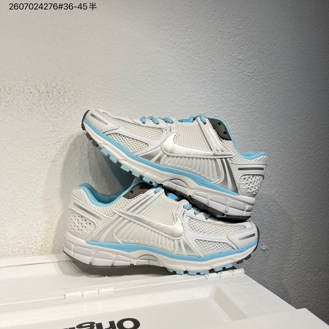 Nike Air Zoom Vomero 5 Sneakers in White and Blue - product image from the listing.