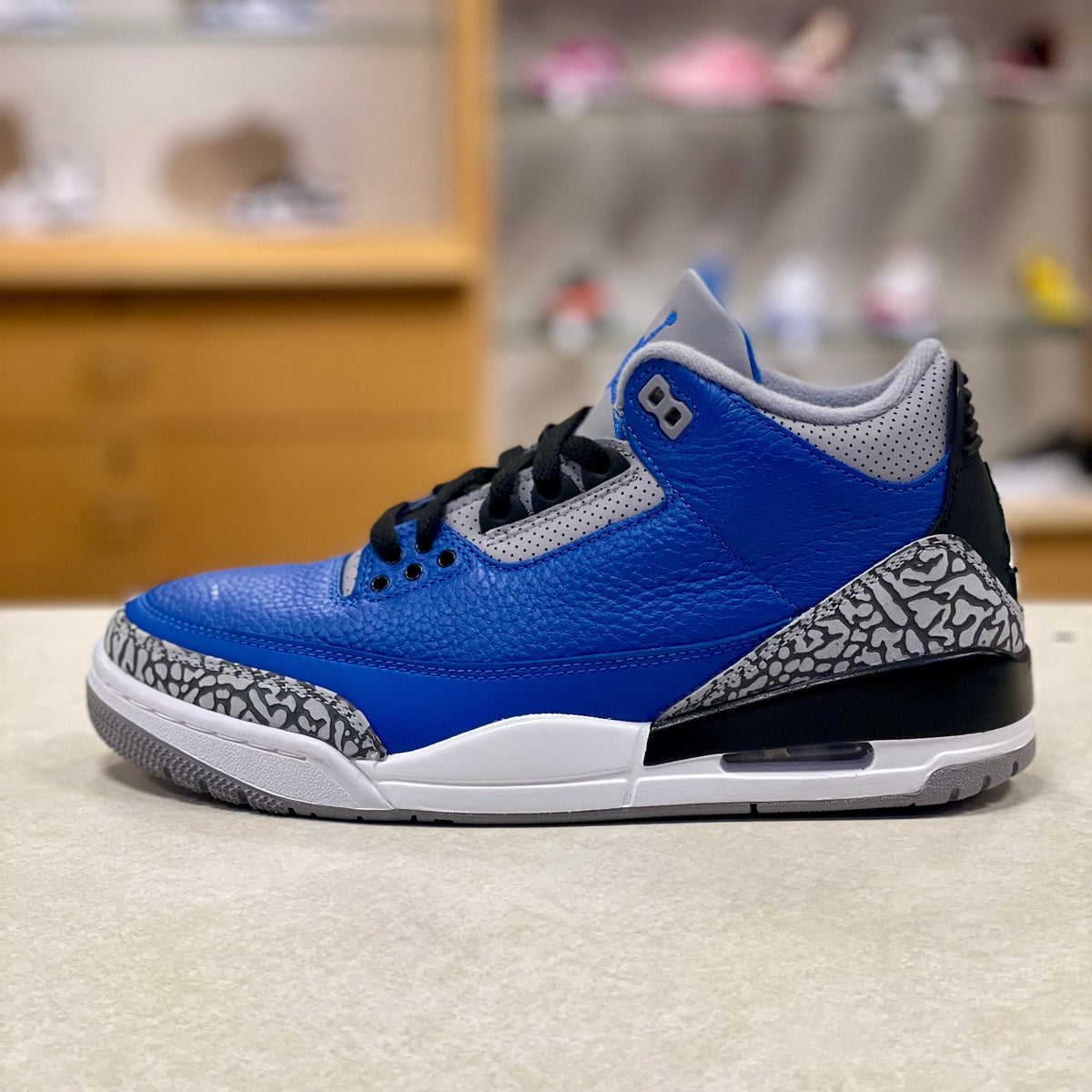 Varsity Royal Cement - Jordan 3 - product image from the listing.