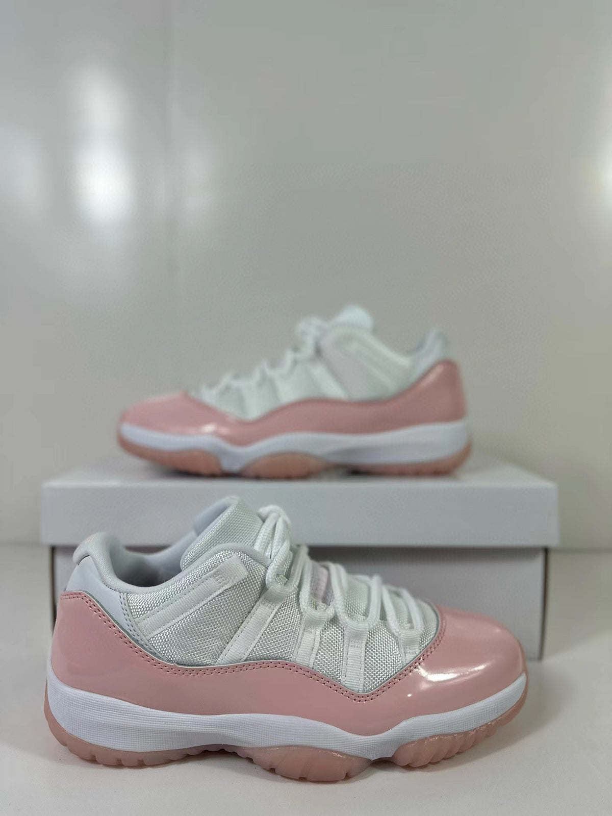 Air Jordan 11 Low Women's Pink Sneakers AH7860-160 - product image from the listing.