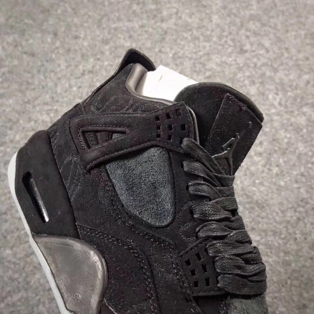 Jordan 4 KAWS Graffiti High-Top Sneakers in Black - product image from the listing.
