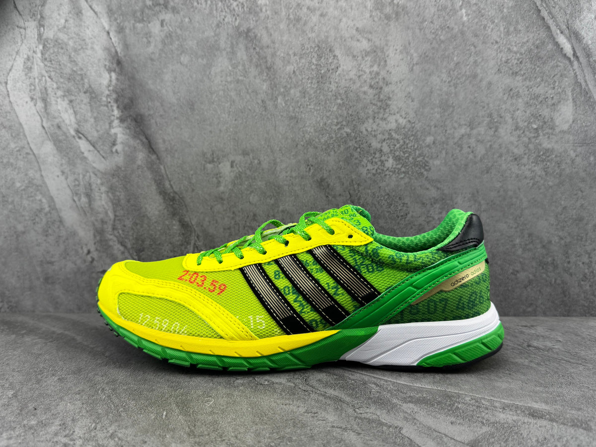 Green and Yellow Adidas Adizero Running Shoes - product image from the listing.