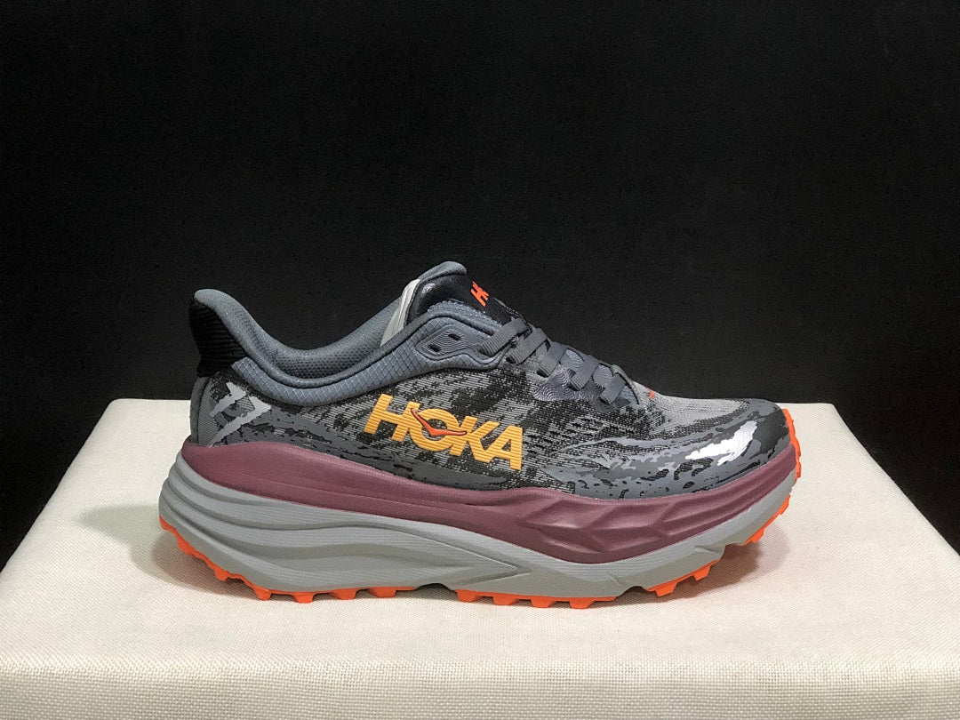 HOKA Stinson 7 Trail Running Shoes in Gray Orange - product image from the listing.