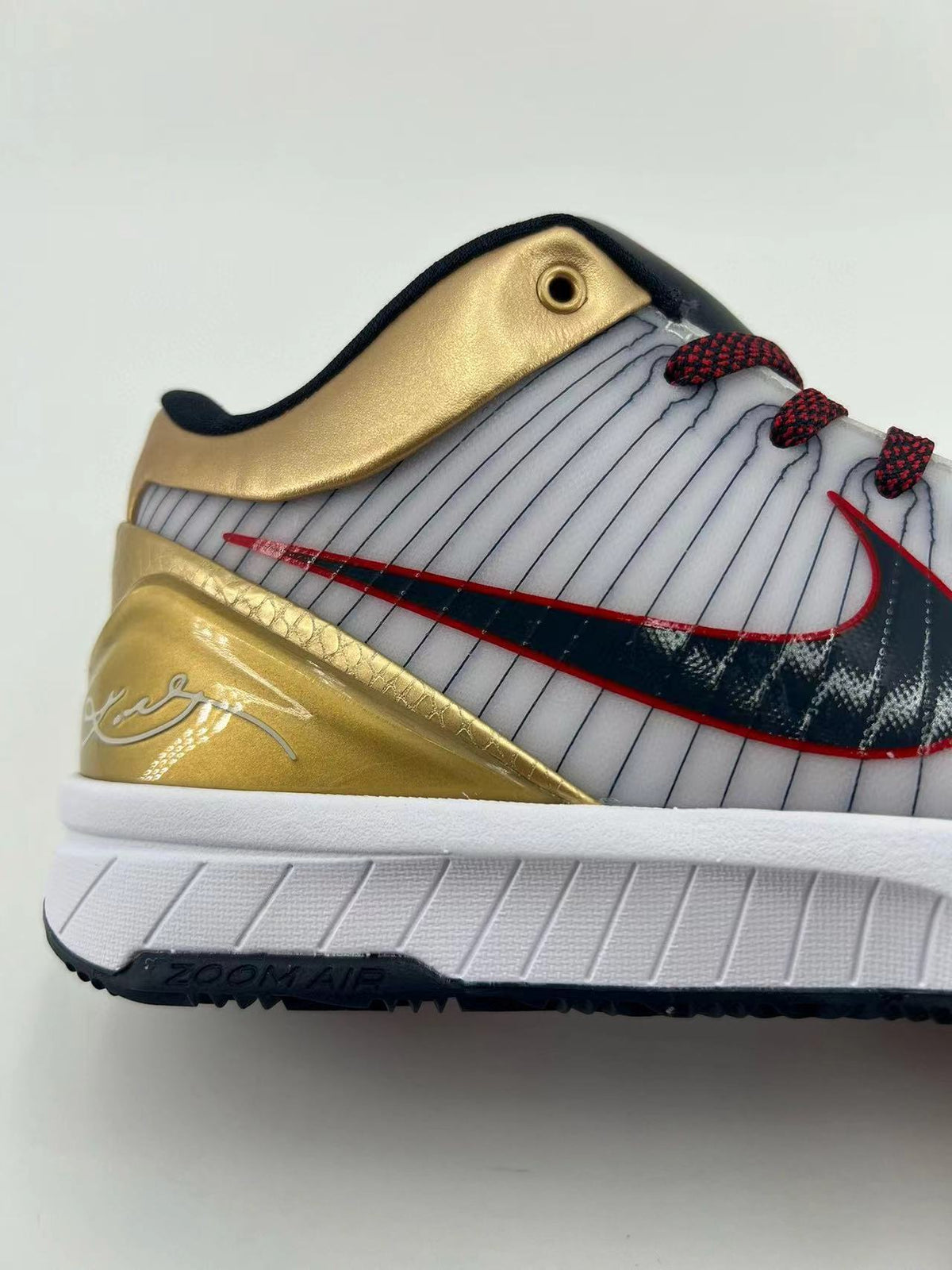 Nike Kobe 4 Protro Sneakers in Gold White 344335-141 - product image from the listing.