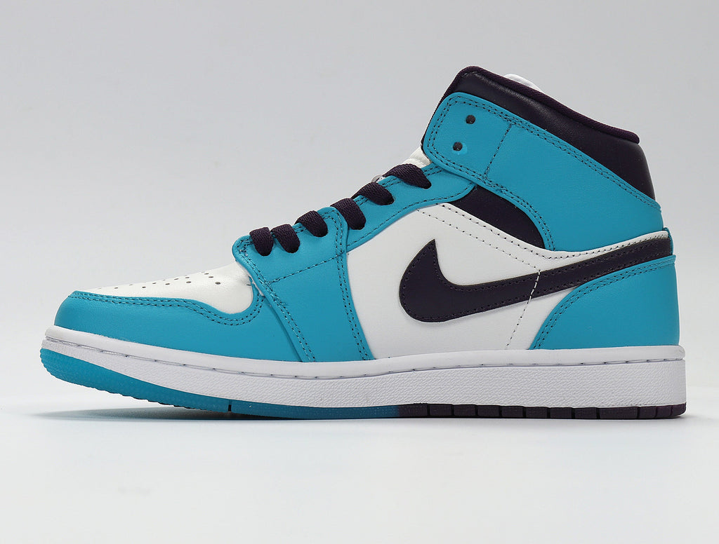 Air Jordan 1 Mid GS White and Blue Sneakers 554724-415 - product image from the listing.