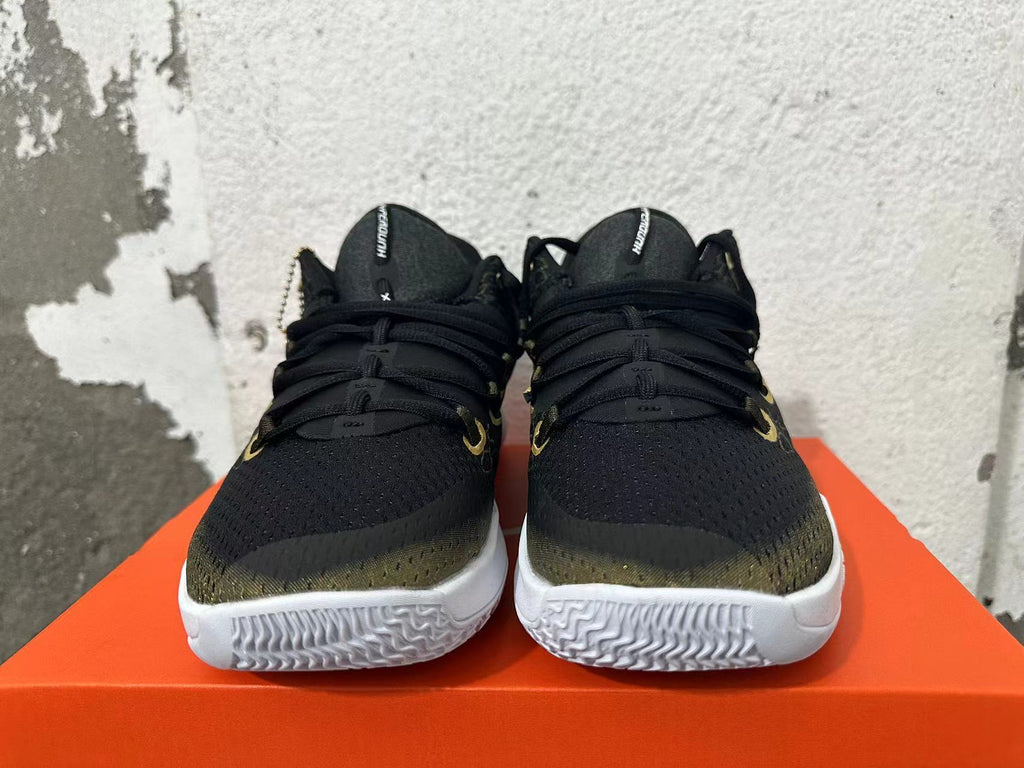 Nike Zoom Basketball Shoes in Black and Gold - product image from the listing.