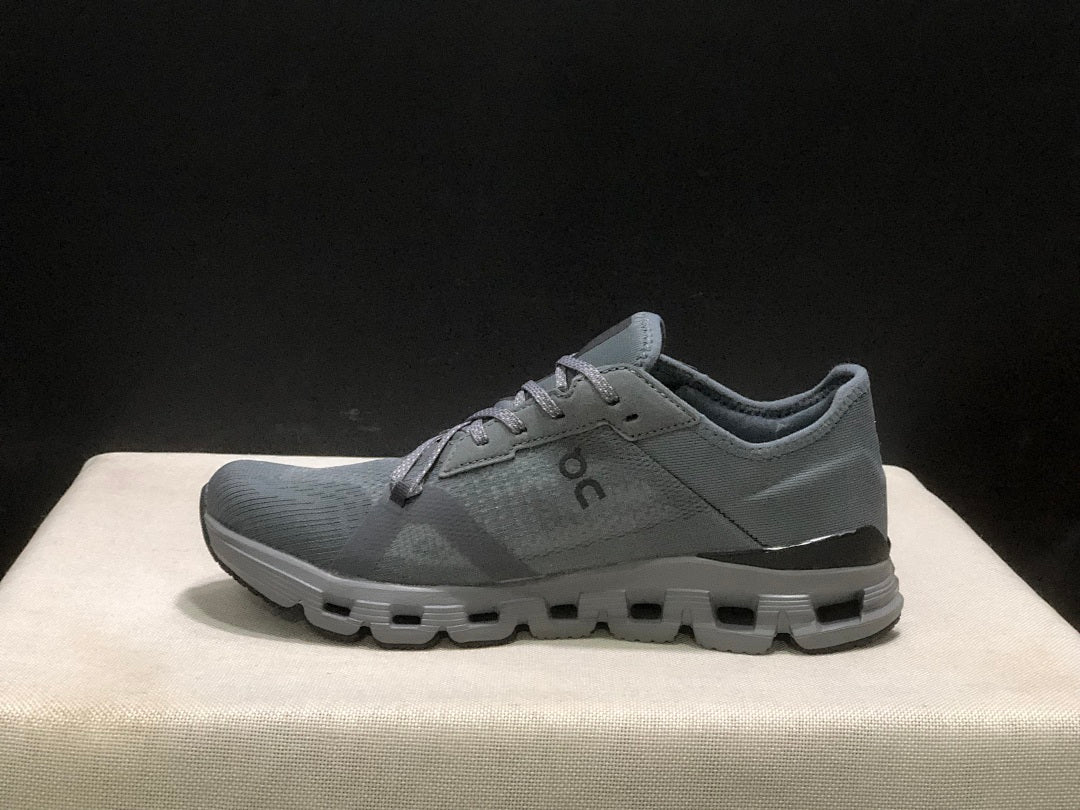 Gray and Black On Cloud X 4 AD Sneakers - product image from the listing.