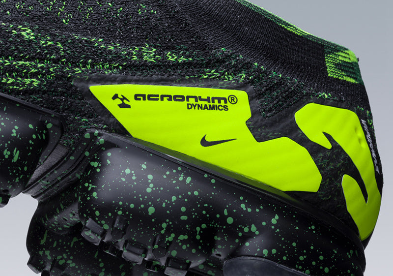 Nike Air VaporMax Moc 2 Acronym in Black Volt AQ0996-007 - product image from the listing.