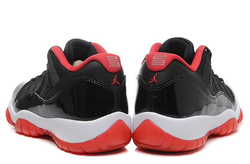 Air Jordan 11 Retro Low Black Red Sneakers - product image from the listing.