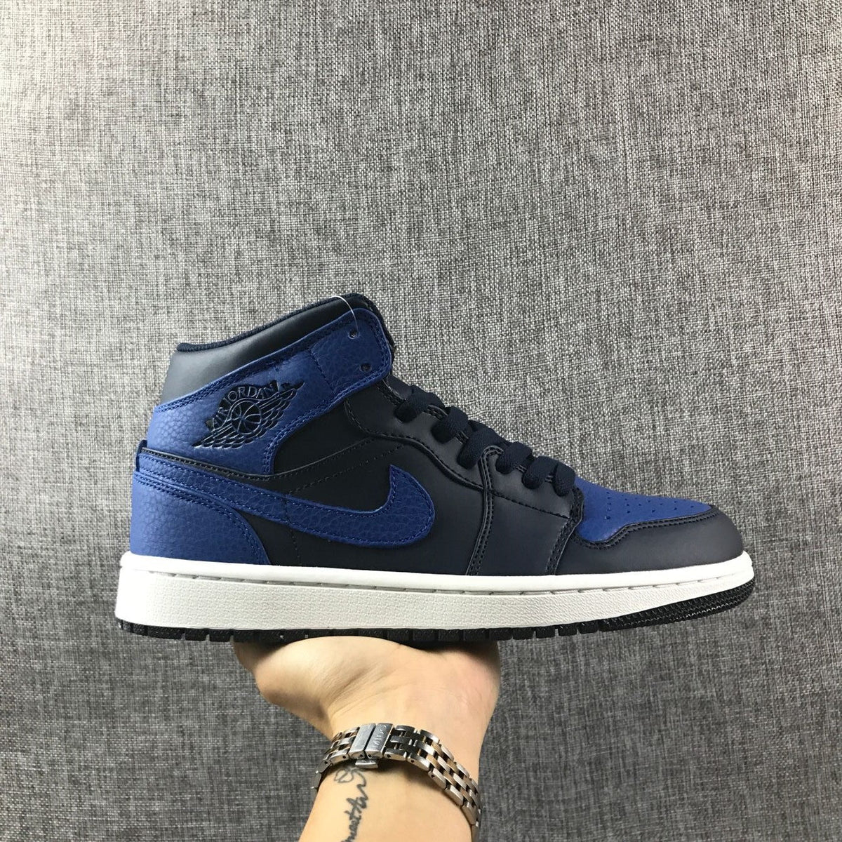 Air Jordan 1 Mid High-Top Sneakers in Black and Royal Blue - product image from the listing.
