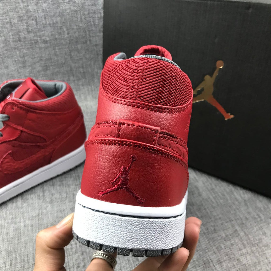 Red and Grey Jordan 1 Mid High-Top Sneakers - product image from the listing.