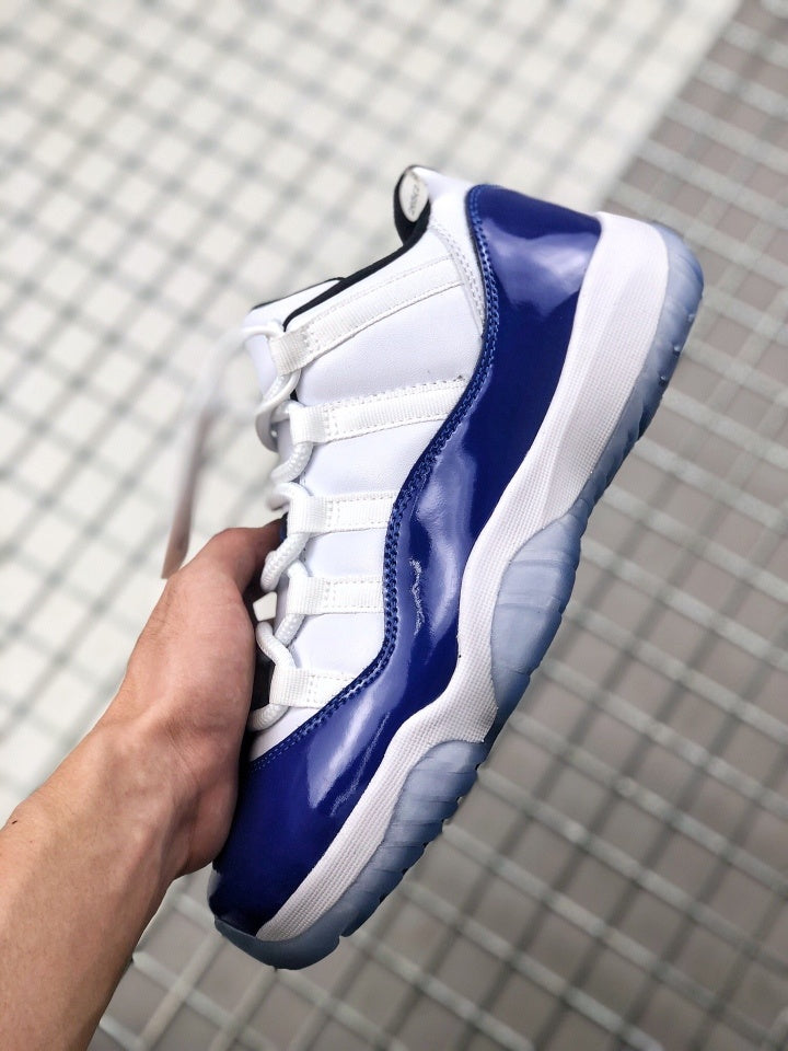 Air Jordan 11 Sneakers in White and Deep Blue BQ3685-001 - product image from the listing.