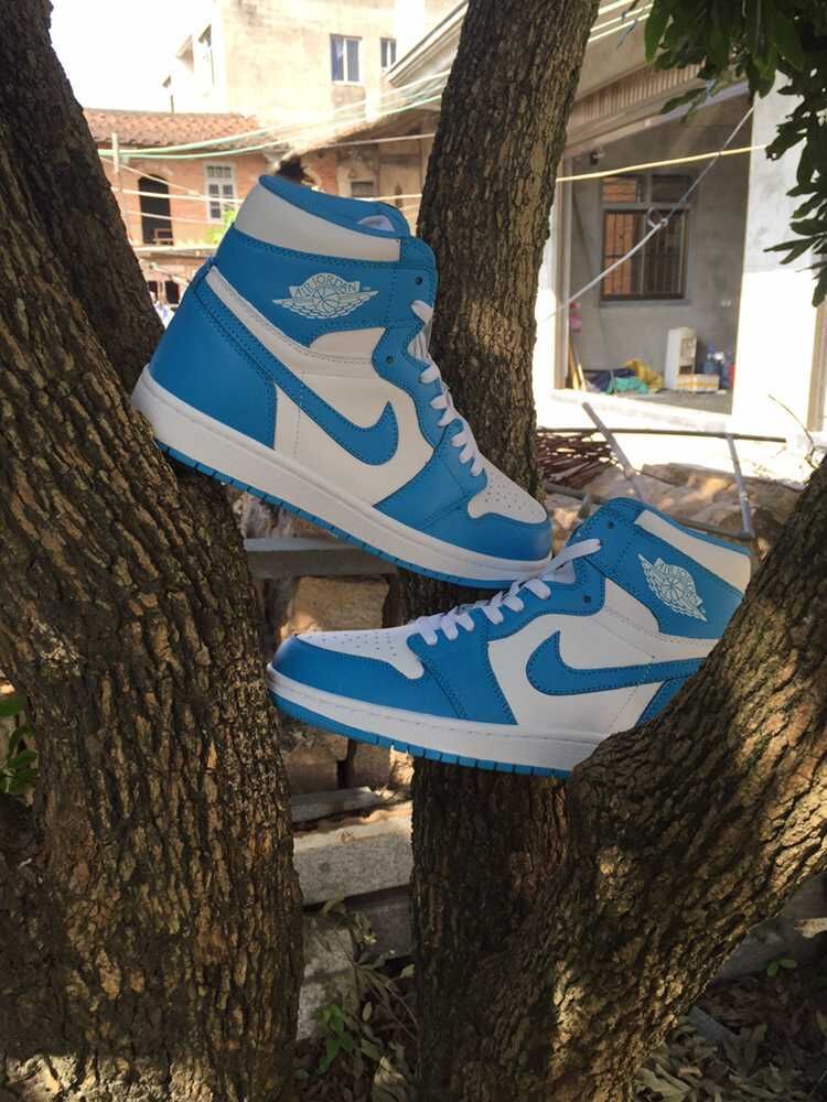 Blue and White Air Jordan 1 High Sneakers - product image from the listing.