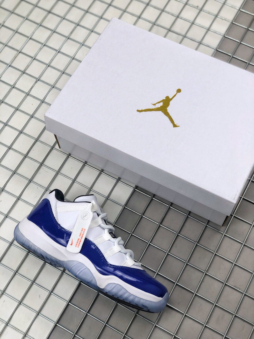 Air Jordan 11 Sneakers in White and Deep Blue BQ3685-001 - product image from the listing.