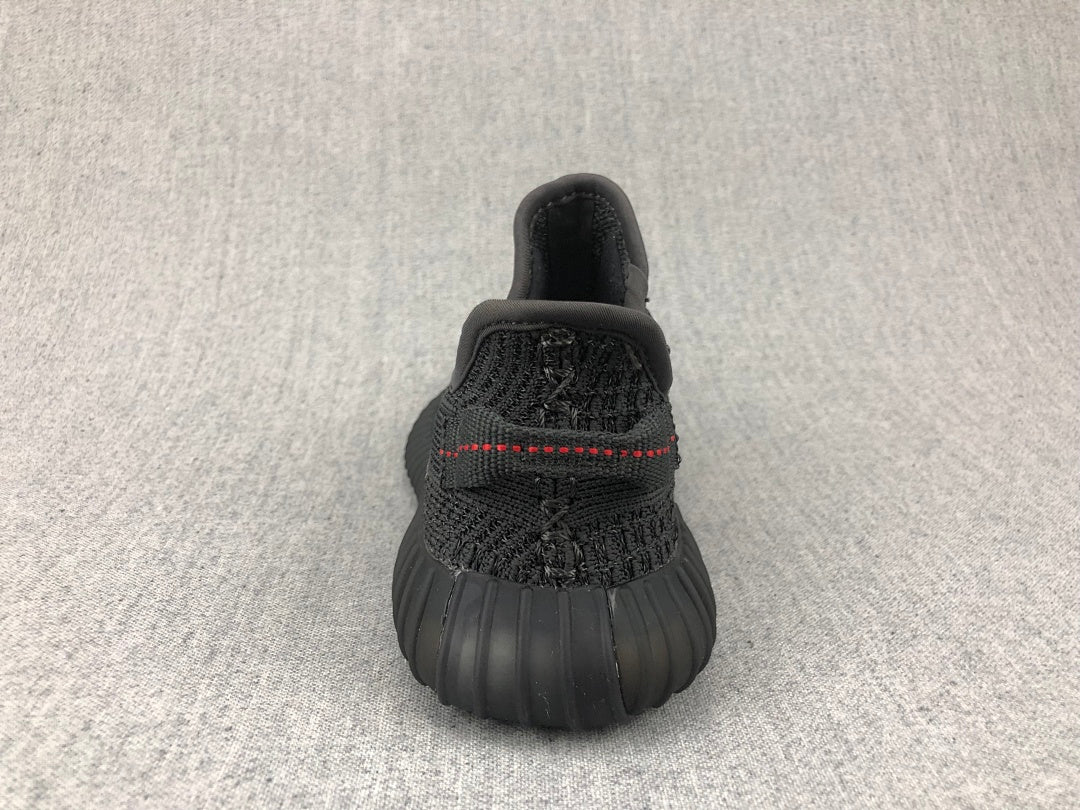 Black Yeezy 350 V2 Kids Sneakers - product image from the listing.
