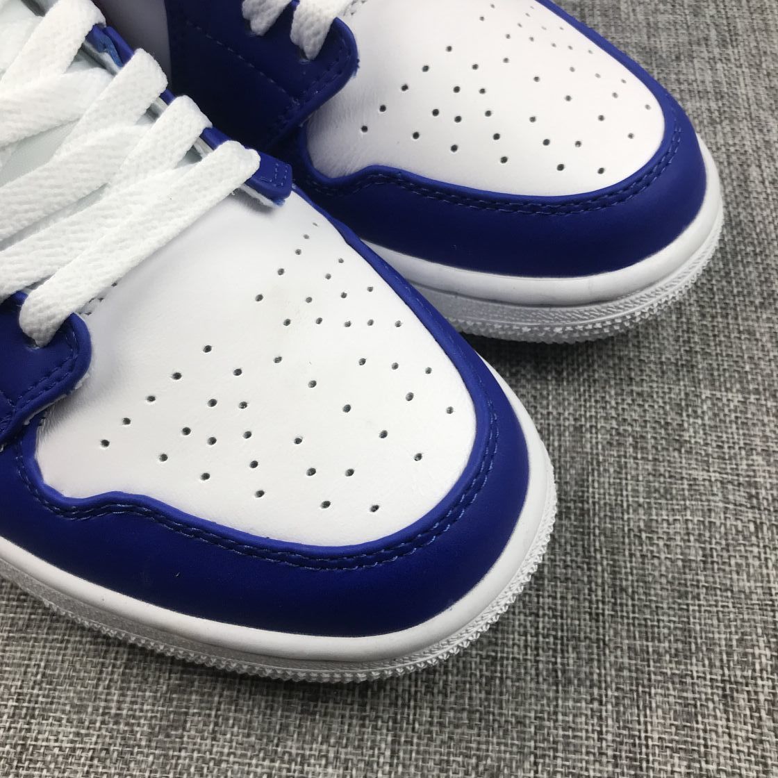 Air Jordan 1 Mid Sneakers in Blue Pink 554724-451 - product image from the listing.