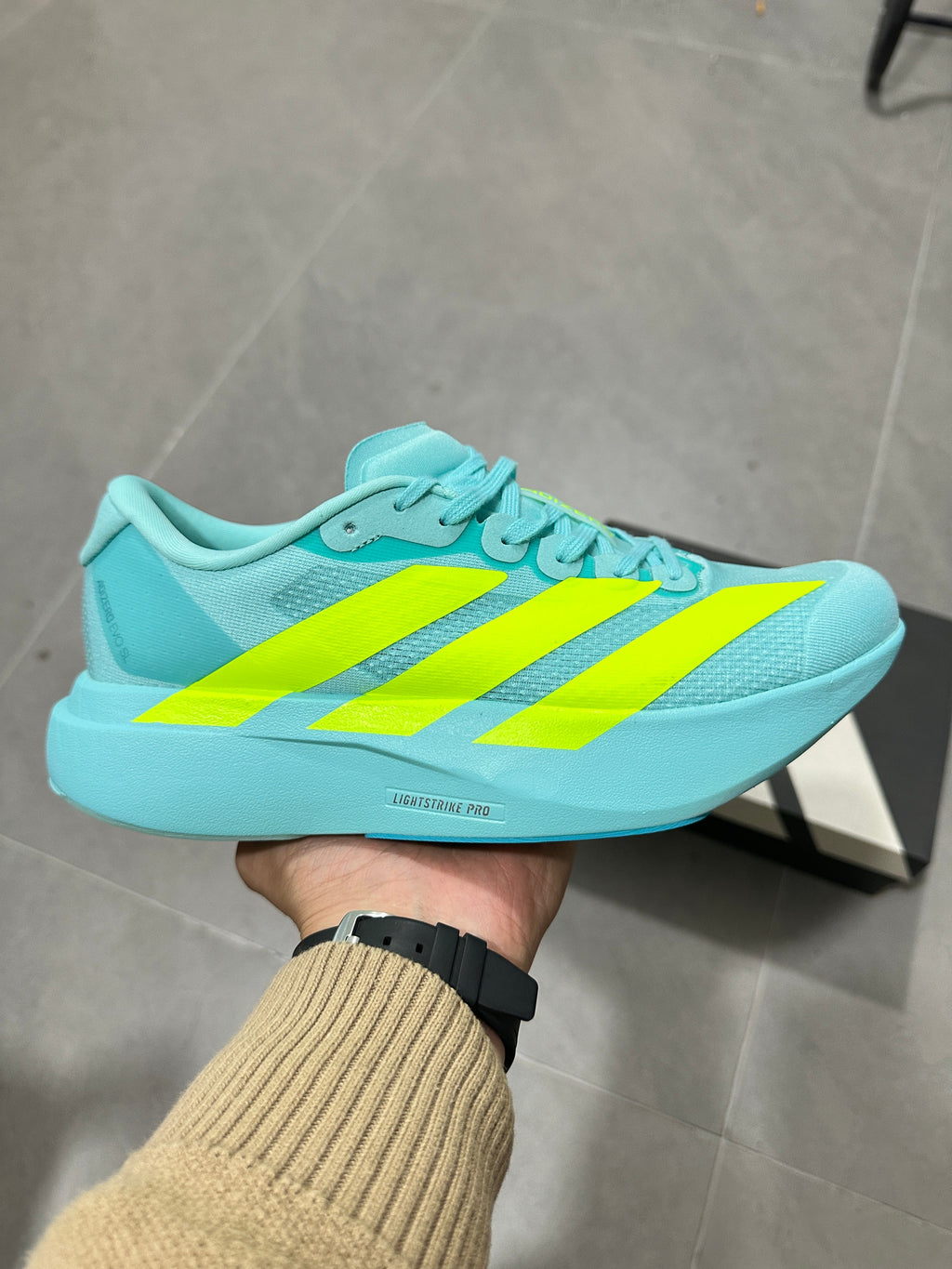 Adidas Lightstrike Pro Running Shoes, in Turquoise and Volt - product image from the listing.