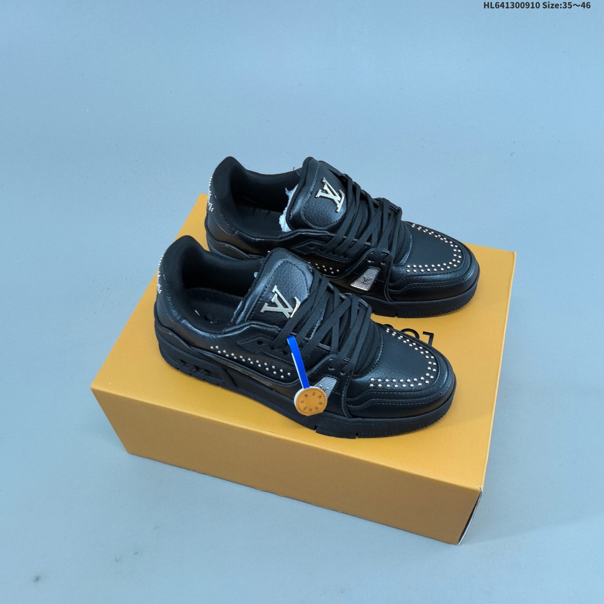 White and Black Louis Vuitton Studded Low-Top Sneakers - product image from the listing.