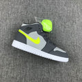 Air Jordan 1 Mid Sneakers in Grey Volt 554724-072 - product image from the listing.