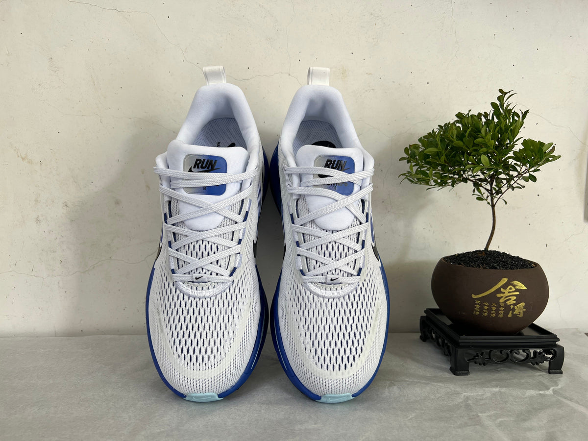 Nike Vomero 18 Running Shoes, in White and Blue - product image from the listing.
