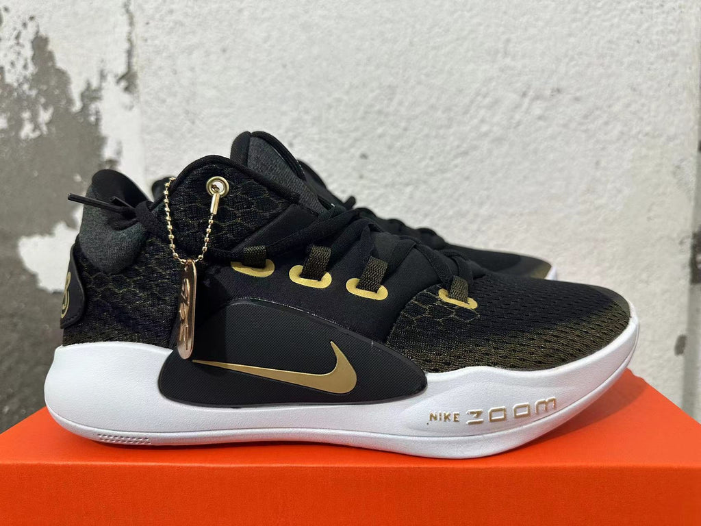 Nike Zoom Basketball Shoes in Black and Gold - product image from the listing.