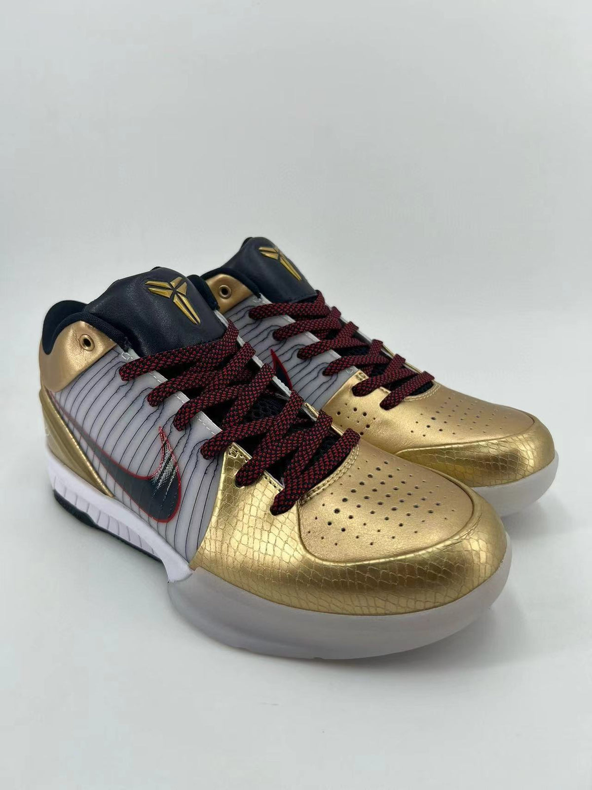 Nike Kobe 4 Protro Sneakers in Gold White 344335-141 - product image from the listing.