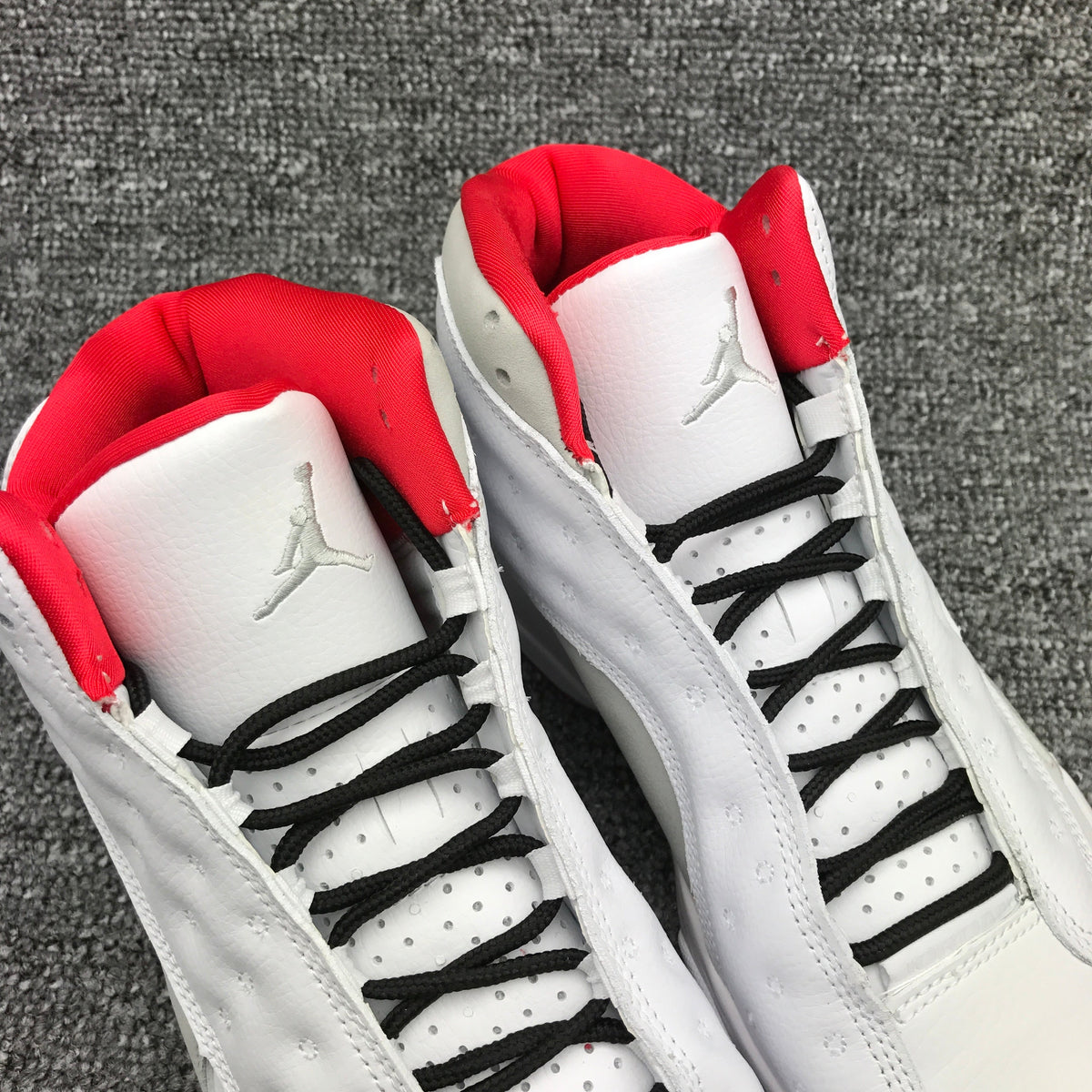 Air Jordan 13 High-Top Sneakers in White and Red - product image from the listing.