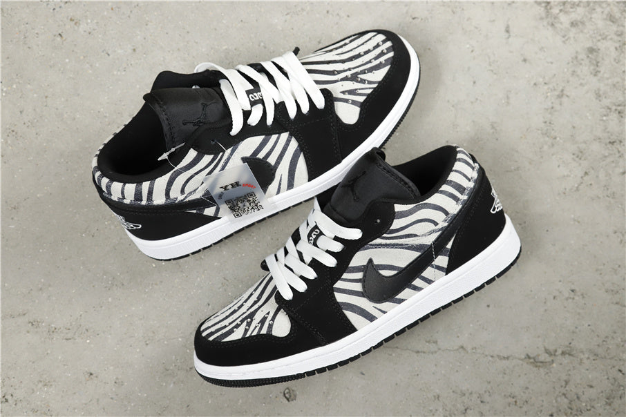Air Jordan 1 Mid Zebra Print Sneakers Black White - product image from the listing.