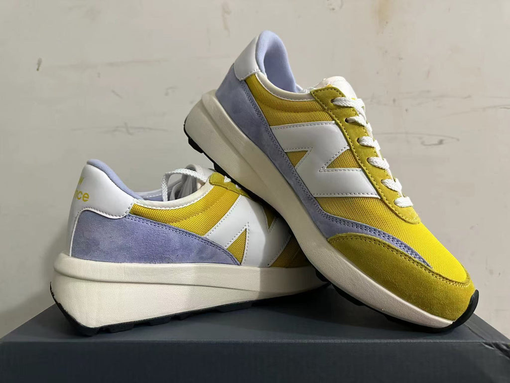 New Balance U370 Trainers in Yellow and Lavender - product image from the listing.