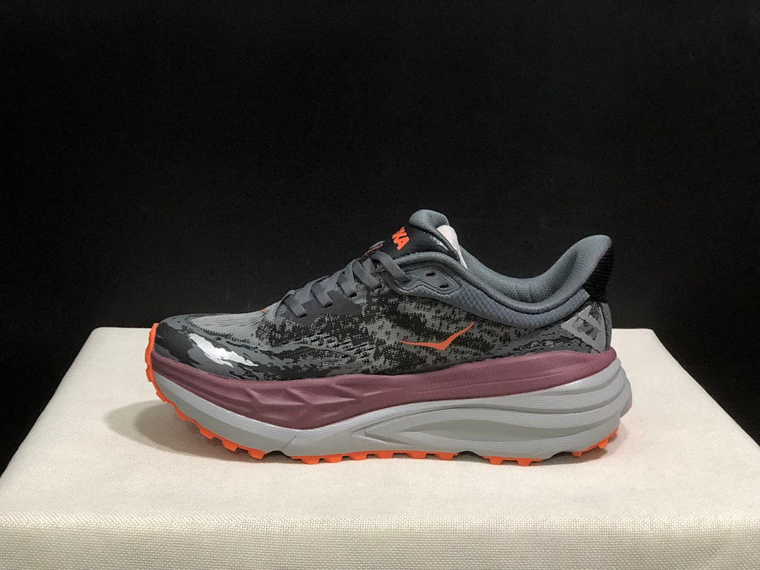 HOKA Stinson 7 Trail Running Shoes in Gray Orange - product image from the listing.