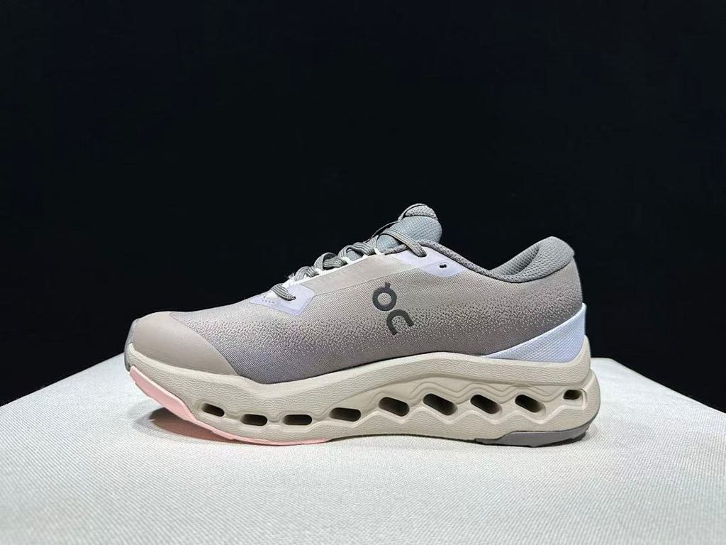 On Cloudsurfer Trail 2 Waterproof Trail Shoes Pink/Brown in Grey - product image from the listing.