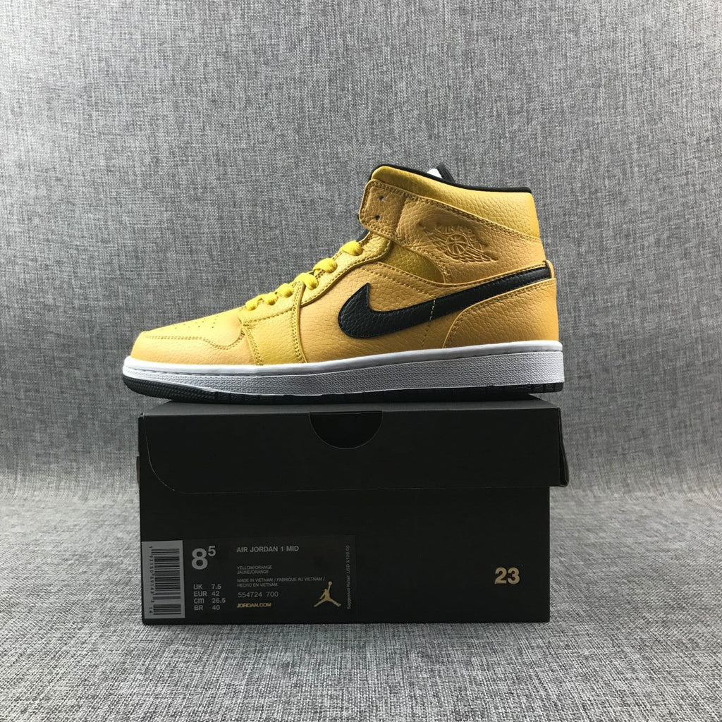Air Jordan 1 Mid Yellow Ochre Sneakers in Black 554724-700 - product image from the listing.