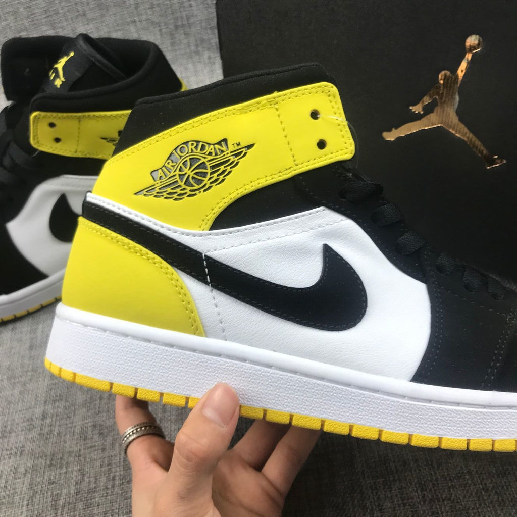 Black Yellow Toe Sneakers - Air Jordan 1 Mid SE 852542-071 - product image from the listing.
