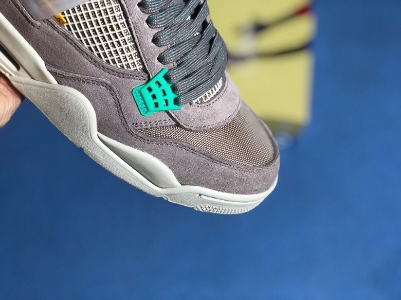 Air Jordan 4 Retro Gray Teal Sneakers - product image from the listing.