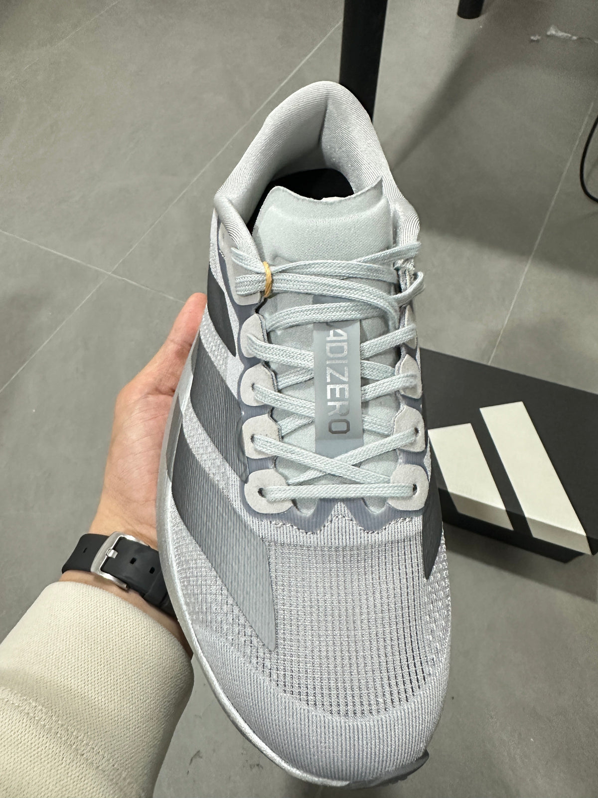 adidas Adizero Evo SL Running Shoes in Light Grey - product image from the listing.