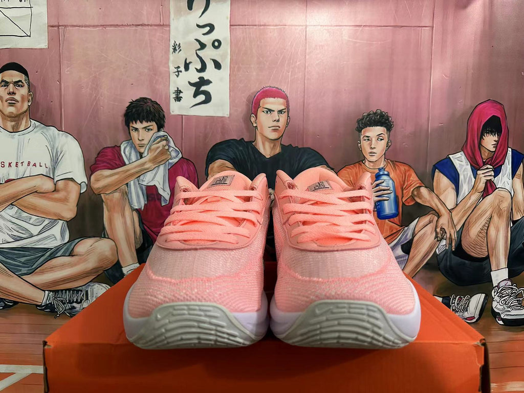 Pink and White Nike Basketball Shoes - product image from the listing.