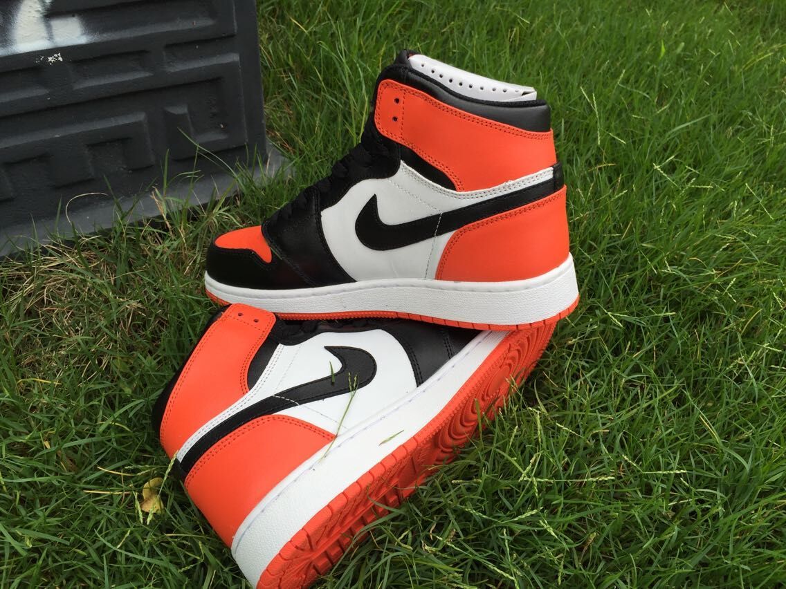 Women's Jordan 1 High Black Orange White Sneakers - product image from the listing.