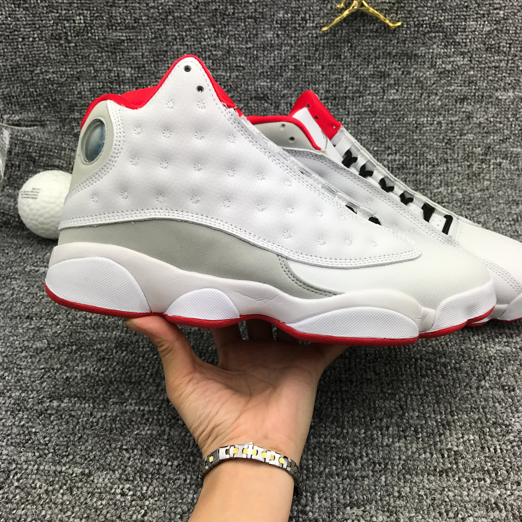 Air Jordan 13 High-Top Sneakers in White and Red - product image from the listing.