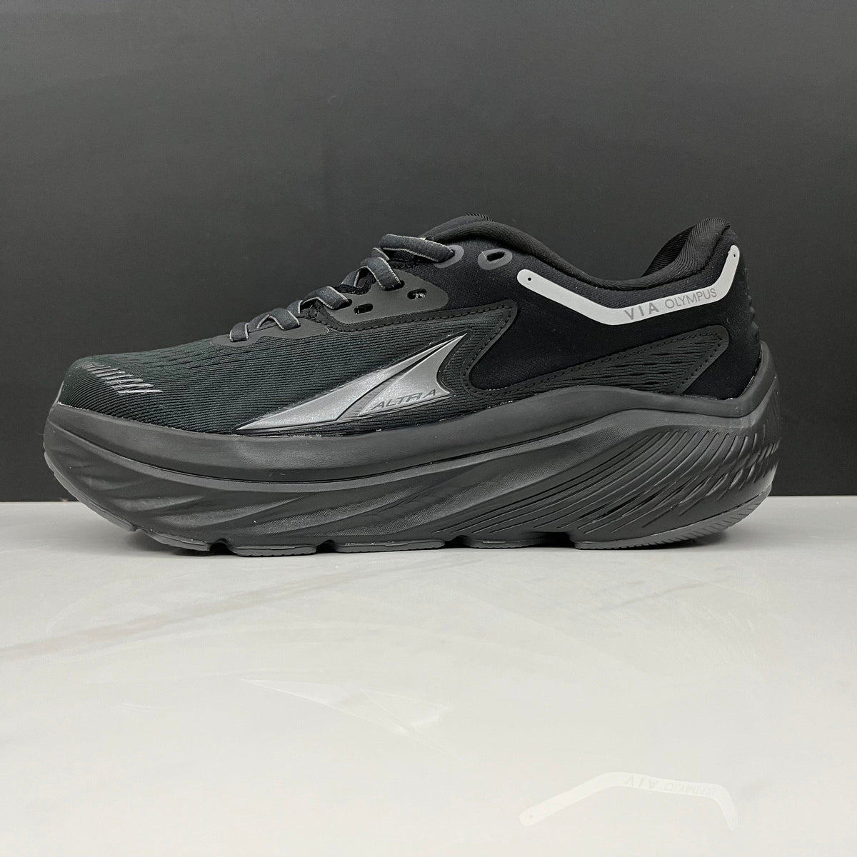 Altra Via Olympus Running Sneakers in Black - product image from the listing.