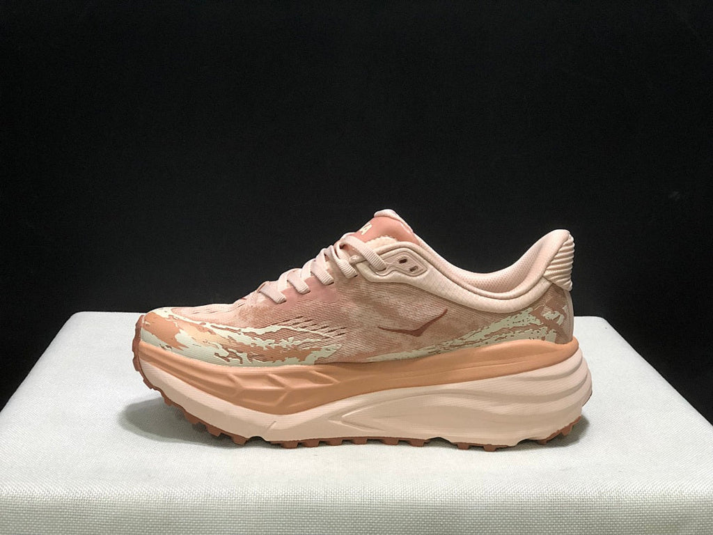 HOKA Stinson 7 Trail Running Shoes in Blush and in Cream - product image from the listing.