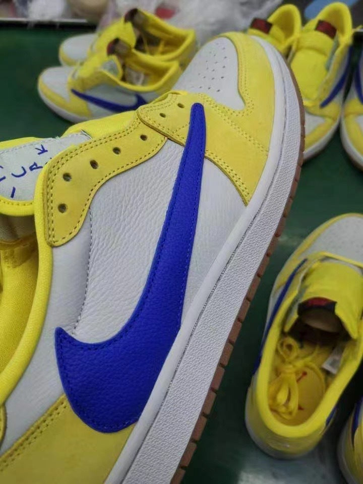 Jordan 1 Low Sneakers in Canary Yellow and Blue DZ4137-700 - product image from the listing.