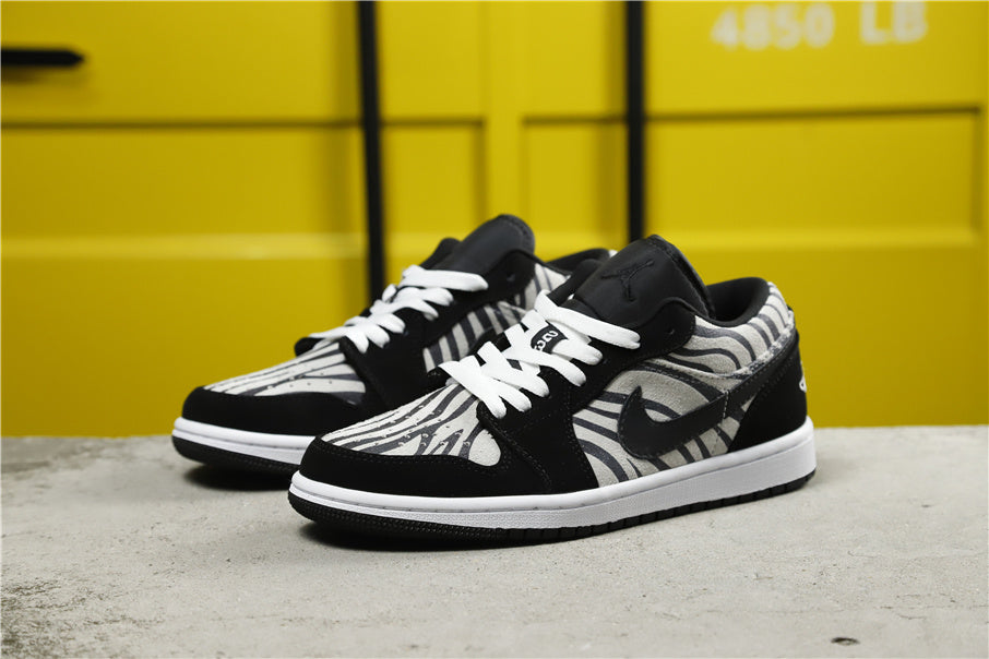 Air Jordan 1 Mid Zebra Print Sneakers Black White - product image from the listing.