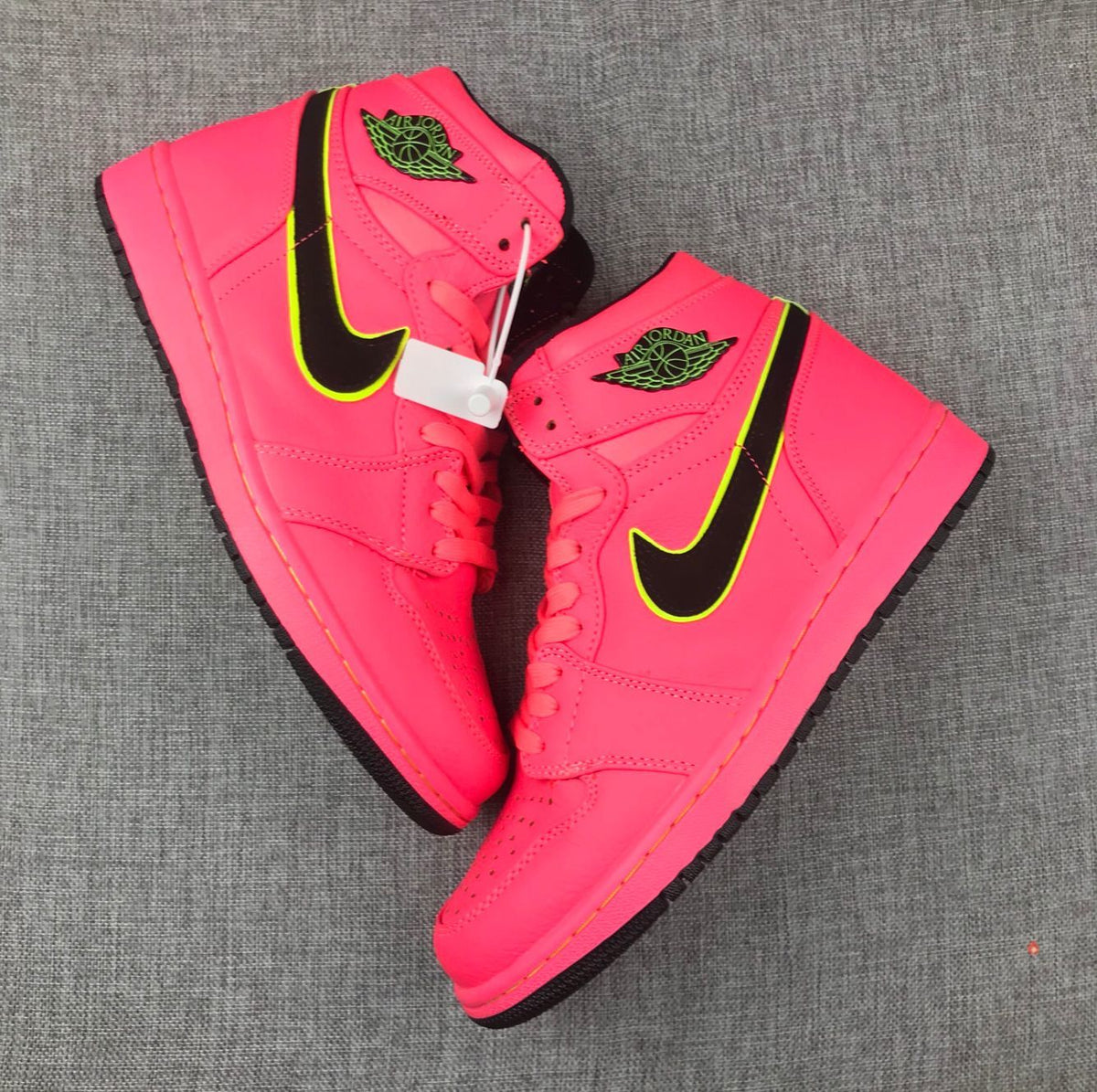 Air Jordan 1 Mid Sneakers in Pink Black Volt AQ9131-600 - product image from the listing.