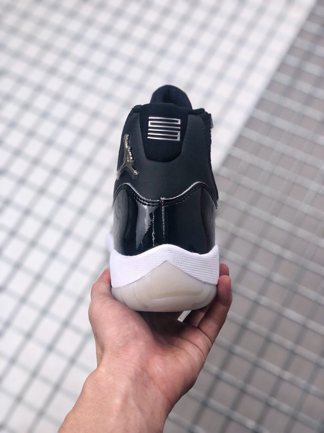 Air Jordan 11 Silver Eyelets Black White Sneakers - product image from the listing.